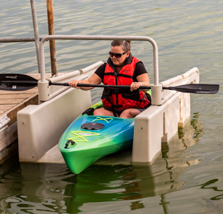 Kayak launching on a small pond