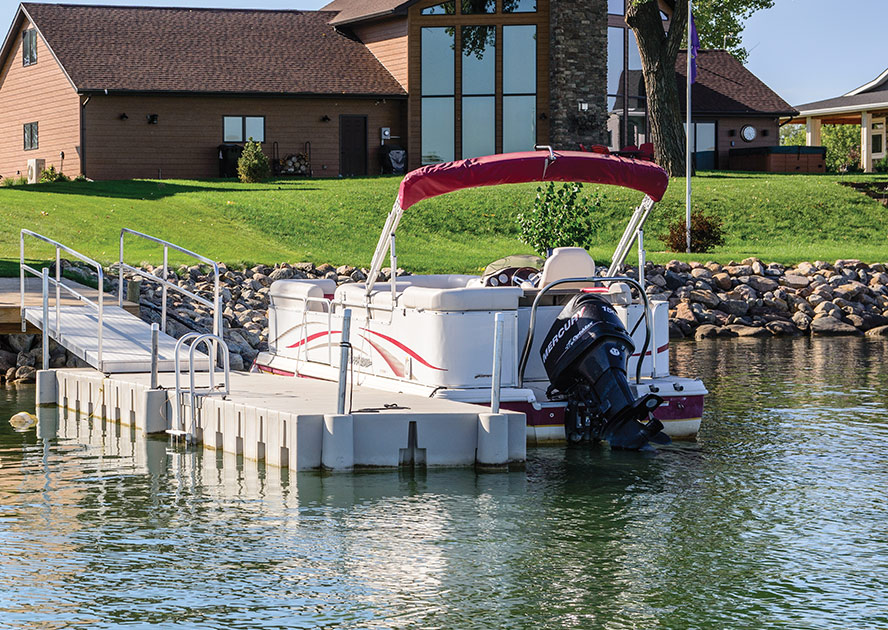 Straight modular floating dock from the 2000 Series, featuring a durable and versatile design, ideal for residential or commercial waterfront use, set on calm waters.