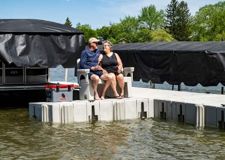 2000 Series modular floating dock system with a durable and adaptable design, ideal for various waterfront uses, shown on calm waters with a picturesque backdrop