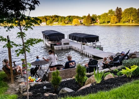 Floating dock at a home with a family enjoying the day