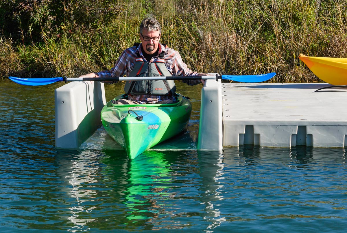 Kayak launch attached to a floating dock